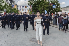 A-woman-posing-in-front-of-the-police,-securing-the-manifestation-of-national-groups-in-Warsaw-20190